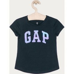 GAP - T-shirt dziecięcy 104-176 cm. Niebieskie bluzki dziewczęce GAP, z aplikacjami, z bawełny, z okrągłym kołnierzem, z krótkim rękawem, krótkie, bez kaptura. Za 99,90 zł.