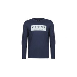 T-shirty z długim rękawem Guess BARRET. Niebieskie t-shirty męskie Guess, s, z aplikacjami, bez kołnierzyka, długie. Za 159,00 zł.