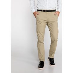 Scotch & Soda Stuart Spodnie Brązowy Beżowy. Pomarańczowe spodnie męskie Scotch & Soda, w paski, z elastanu. Za 404,95 zł.