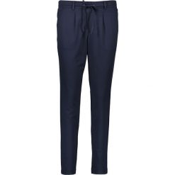 Spodnie w kolorze granatowym. Niebieskie rurki damskie Tom Tailor, l, w paski. W wyprzedaży za 107,95 zł.