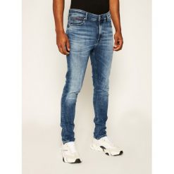 Jeansy Skinny Fit Tommy Jeans DM0DM06879. Niebieskie jeansy męskie Tommy Jeans, m, bez wzorów. W wyprzedaży za 269,00 zł.