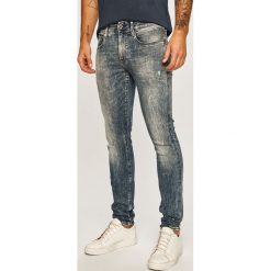 G-Star Raw - Jeansy 3301. Niebieskie jeansy męskie G-Star RAW, z aplikacjami, retro. W wyprzedaży za 299,90 zł.