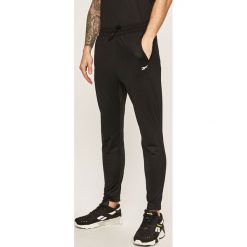 Reebok - Spodnie. Czarne spodnie męskie Reebok, s, z poliesteru, sportowe. Za 169,90 zł.