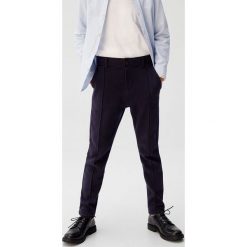 Mango Kids - Spodnie dziecięce Jet 110-164 cm. Niebieskie spodnie chłopięce Mango Kids, bez wzorów, z bawełny. Za 79,90 zł.