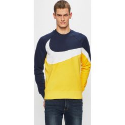 Nike Sportswear - Bluza. Niebieskie bluzy męskie Nike Sportswear, xl, z nadrukiem, z bawełny, z okrągłym kołnierzem, bez rękawów, bez kaptura. W wyprzedaży za 179,90 zł.