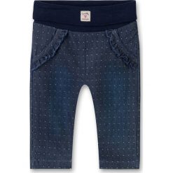 Spodnie w kolorze granatowym. Niebieskie spodnie niemowlęce Sanetta, w kropki. W wyprzedaży za 49,95 zł.
