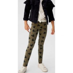 Mango Kids - Legginsy dziecięce Mouse 110 - 164 cm. Żółte spodnie dziewczęce Mango Kids, bez wzorów, z elastanu. Za 59,90 zł.