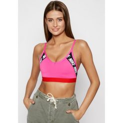 Biustonosz top NIKE Indi Light -Support Logo CJ0559. Różowe topy damskie Nike, m, bez wzorów, z elastanu, bez kołnierzyka. Za 149,00 zł.