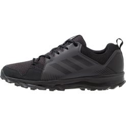 Adidas Performance TERREX TRACEROCKER Obuwie hikingowe core black/utility black. Czarne buty sportowe męskie marki adidas Performance, z tworzywa sztucznego, bez zapięcia, outdoorowe. Za 379,00 zł.