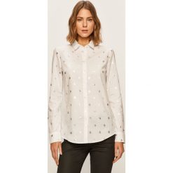 Tommy Hilfiger - Koszula. Białe bluzki damskie TOMMY HILFIGER, na co dzień, bez wzorów, z bawełny, eleganckie, z klasycznym kołnierzykiem, z długim rękawem. W wyprzedaży za 249,90 zł.
