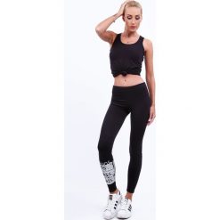 Czarne legginsy ocieplane z aplikacją 9440. Czarne legginsy marki Fasardi, l, z aplikacjami. Za 49,00 zł.