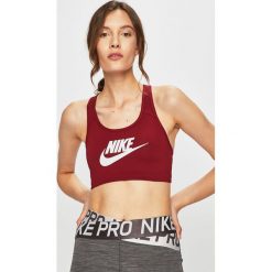 Nike - Biustonosz sportowy. Czerwone biustonosze sportowe damskie Nike, s, z nadrukiem, z elastanu, dri-fit (nike). W wyprzedaży za 99,90 zł.