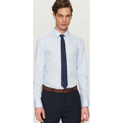 Koszula w kratkę regular fit - Niebieski. Niebieskie koszule męskie w kratę marki Reserved, s. Za 99,99 zł.