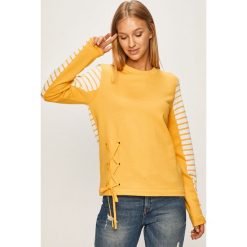 Tommy Hilfiger - Bluza. Żółte bluzy damskie TOMMY HILFIGER, s, bez wzorów, z bawełny, bez rękawów, bez kaptura. W wyprzedaży za 279,90 zł.