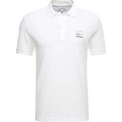Lacoste Koszulka polo blanc. Białe koszulki męskie Lacoste, xl, bez wzorów, z bawełny, polo, bez rękawów. Za 499,00 zł.