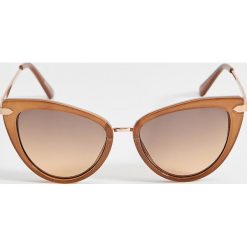 Okulary przeciwsłoneczne cat eye - Brązowy. Pomarańczowe okulary przeciwsłoneczne damskie Mohito. Za 49,99 zł.