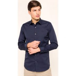 Koszula Lacoste CH5366. Białe koszule męskie Lacoste, m, bez wzorów, z elastanu, biznesowe, bez kołnierzyka, bez rękawów. W wyprzedaży za 269,00 zł.