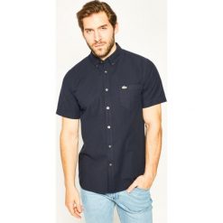 Koszula Lacoste CH4975. Białe koszule męskie Lacoste, m, bez wzorów, casualowe, bez kołnierzyka, bez rękawów. W wyprzedaży za 229,00 zł.