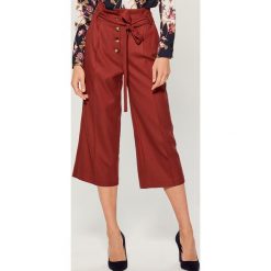 Spodnie culotte z wiązaniem - Bordowy. Spodnie damskie Mohito. W wyprzedaży za 39,99 zł.