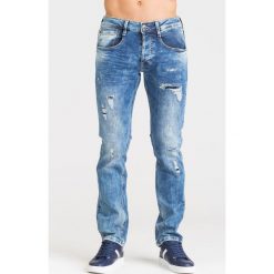 NIEBIESKIE JEANSY GUESS Z PRZETARCIAMI. Niebieskie jeansy męskie Guess, m, z aplikacjami. Za 294,50 zł.