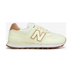 New Balance 574 Tenisówki Żółty. Żółte trampki i tenisówki damskie New Balance, bez wzorów, z materiału, bez zapięcia. Za 430,95 zł.
