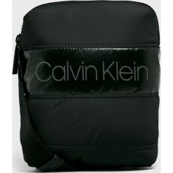 Calvin Klein - Saszetka. Niebieskie torby męskie skórzane Calvin Klein, w paski, z poliesteru, casualowe, małe. W wyprzedaży za 199,90 zł.