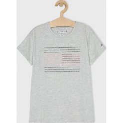 Tommy Hilfiger - Top dziecięcy 128-176 cm. Szare bluzki dziewczęce TOMMY HILFIGER, z nadrukiem, z bawełny, z okrągłym kołnierzem, z krótkim rękawem, krótkie, bez kaptura. W wyprzedaży za 99,90 zł.