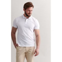 Koszulka polo w kolorze białym. Białe koszulki męskie TATUUM, xl, bez wzorów, z bawełny, polo, bez rękawów. W wyprzedaży za 64,95 zł.