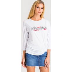 BLUZKA LIU JO SPORT. Białe bluzki sportowe damskie Liu Jo Sport, s, z nadrukiem, z materiału, z okrągłym kołnierzem, bez rękawów, bez kaptura. Za 319,00 zł.