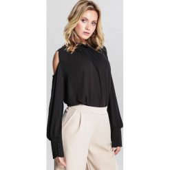 Czarna Bluzka Heartthrob. Czarne bluzki damskie marki other, s, bez wzorów, ze stójką, z długim rękawem. Za 79,99 zł.