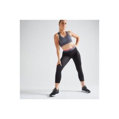 Legginsy 7/8 fitness kardio damskie 100 czarne. Czarne legginsy sportowe damskie DOMYOS, l, bez wzorów, z elastanu, na fitness i siłownię. Za 49,99 zł.