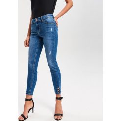 Jeansy slim fit - Niebieski. Niebieskie jeansy damskie relaxed fit marki Reserved. Za 99,99 zł.