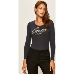 Guess Jeans - Longsleeve. Czarne bluzki damskie Guess Jeans, s, z aplikacjami, z bawełny, z okrągłym kołnierzem. Za 219,90 zł.