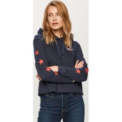 Tommy Jeans - Bluza. Białe bluzy damskie Tommy Jeans, s, z nadrukiem, z bawełny, bez rękawów, z kapturem. Za 499,90 zł.