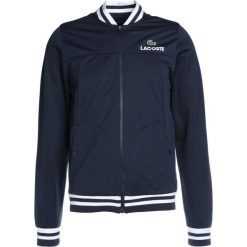 Lacoste Sport Kurtka sportowa navy blue/white. Niebieskie kurtki sportowe męskie Lacoste Sport, m, z materiału. W wyprzedaży za 389,25 zł.