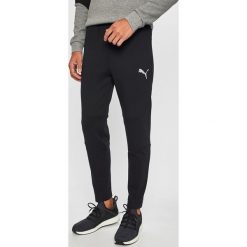 Puma - Spodnie 580103. Czarne spodnie męskie Puma, na co dzień, m, z nadrukiem, z elastanu, sportowe. Za 269,90 zł.