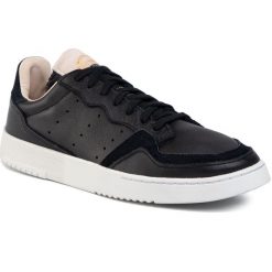 Buty adidas - Supercourt EF9189 Cblack/Cblack/Crywht. Czarne półbuty męskie Adidas, na co dzień, bez wzorów, ze skóry ekologicznej, klasyczne, bez zapięcia. W wyprzedaży za 249,00 zł.
