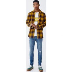 Jeansy skinny fit z przetarciami. Niebieskie jeansy męskie marki Pull&Bear, m, bez wzorów. Za 139,00 zł.
