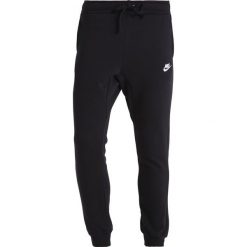 Nike Sportswear Spodnie treningowe black/white. Czarne spodnie dresowe męskie Nike Sportswear, z bawełny. Za 379,00 zł.
