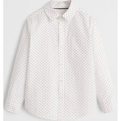 Mango Kids - Koszula dziecięca 116 - 164 cm. Białe koszule chłopięce Mango Kids, bez wzorów, z bawełny, eleganckie, z klasycznym kołnierzykiem, z długim rękawem, długie. Za 59,90 zł.