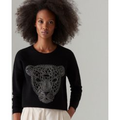 Sweter z cekinowym zdobieniem - Czarny. Czarne swetry damskie Mohito, s, z aplikacjami, bez rękawów, bez kaptura. Za 119,99 zł.