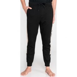 Calvin Klein Spodnie do spania Czarny Beżowy. Brązowe spodnie męskie Calvin Klein, xl, bez wzorów, z elastanu. Za 326,95 zł.