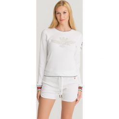 BLUZA GIROCOLLO Aeronautica Militare. Białe bluzy damskie Aeronautica Militare, s, z aplikacjami, bez rękawów, bez kaptura. Za 509,00 zł.
