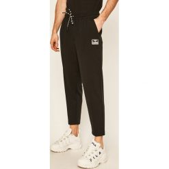 Hummel - Spodnie. Czarne spodnie męskie Hummel, na co dzień, s, bez wzorów, z elastanu. Za 259,90 zł.