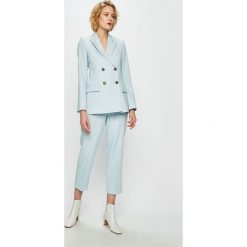 Tommy Hilfiger - Spodnie. Niebieskie spodnie damskie TOMMY HILFIGER, w paski, z elastanu, casualowe. W wyprzedaży za 459,90 zł.