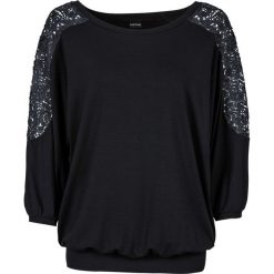 Shirt oversize z koronką bonprix czarny. Czarne koszulki damskie bonprix, w koronkowe wzory, z koronki, bez kołnierzyka, bez rękawów. Za 59,99 zł.