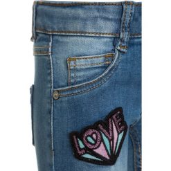 Mothercare BADGE Jeans Skinny Fit denim. Niebieskie jeansy dziewczęce marki mothercare, z bawełny. Za 129,00 zł.