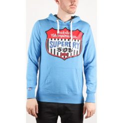 SuperDry Bluza Niebieski. Niebieskie bluzy męskie Superdry, l, z nadrukiem, z bawełny, bez kołnierzyka, bez rękawów, bez kaptura. Za 395,95 zł.