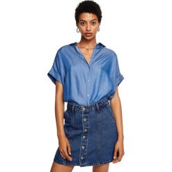 Mango - Koszula Parisian. Niebieskie bez kategorii marki Mango, s, z lyocellu, klasyczne, z klasycznym kołnierzykiem, z krótkim rękawem. W wyprzedaży za 49,90 zł.