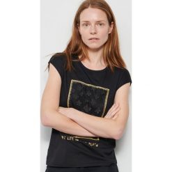 T-shirt z bawełny i modalu - Czarny. Czarne t-shirty damskie Reserved, s, bez wzorów, z bawełny, bez kołnierzyka. W wyprzedaży za 39,99 zł.